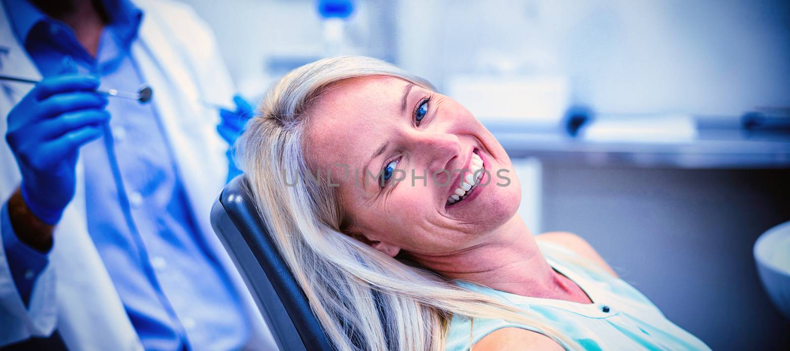 Portrait of female patient smiling in dental clinic