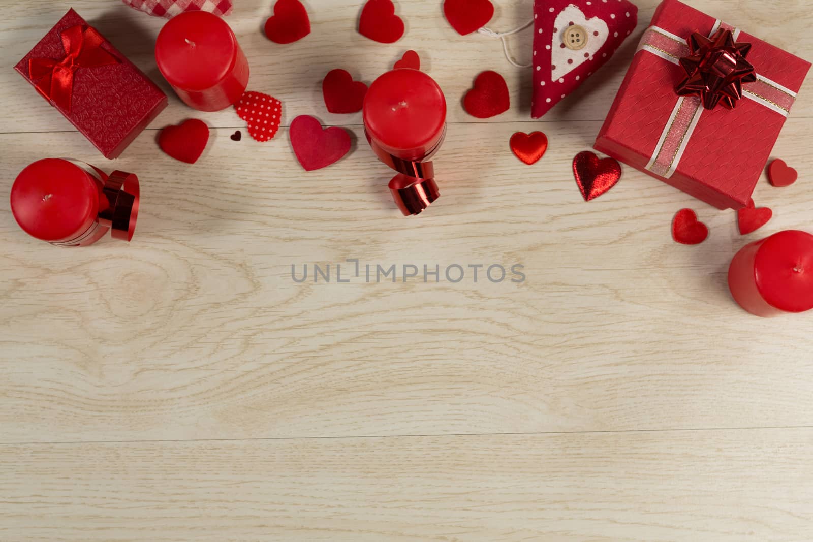 Overhead of gift boxes and heart shape decorations on wooden table
