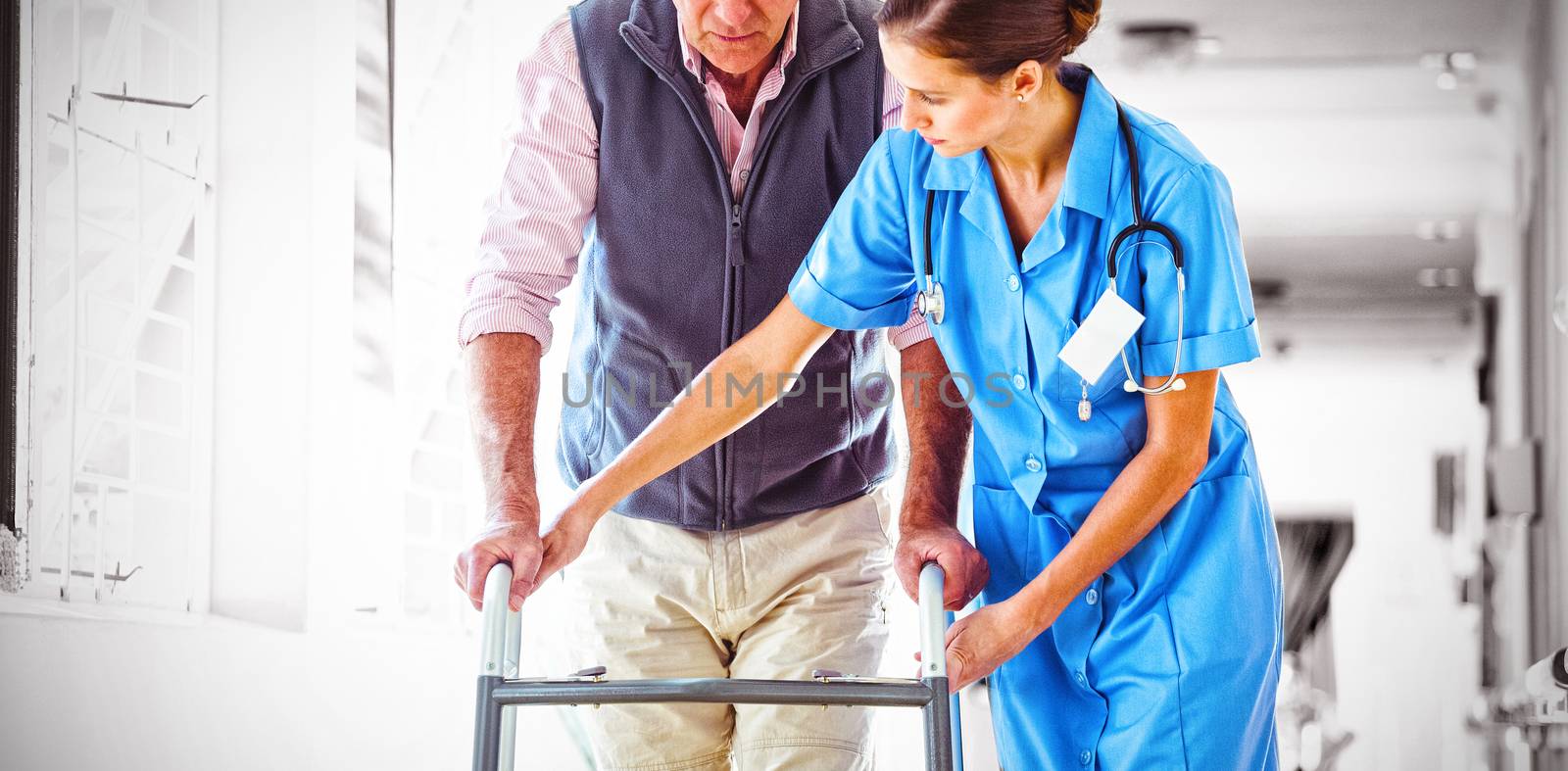Nurse helping senior man with walking aid in a retirement home