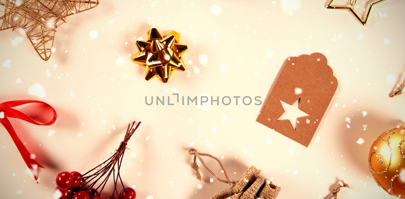 Snow falling against close-up on several christmas ornaments