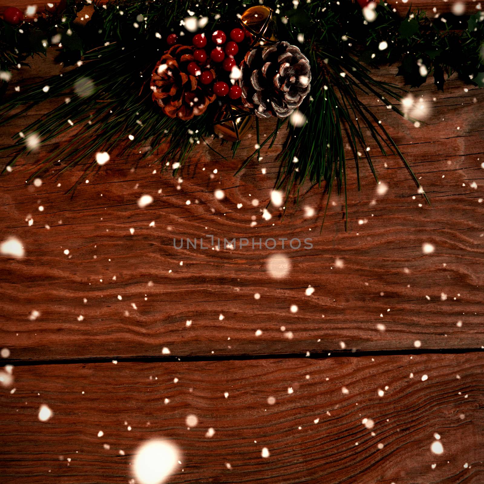 Snow falling against old christmas garland for copy space