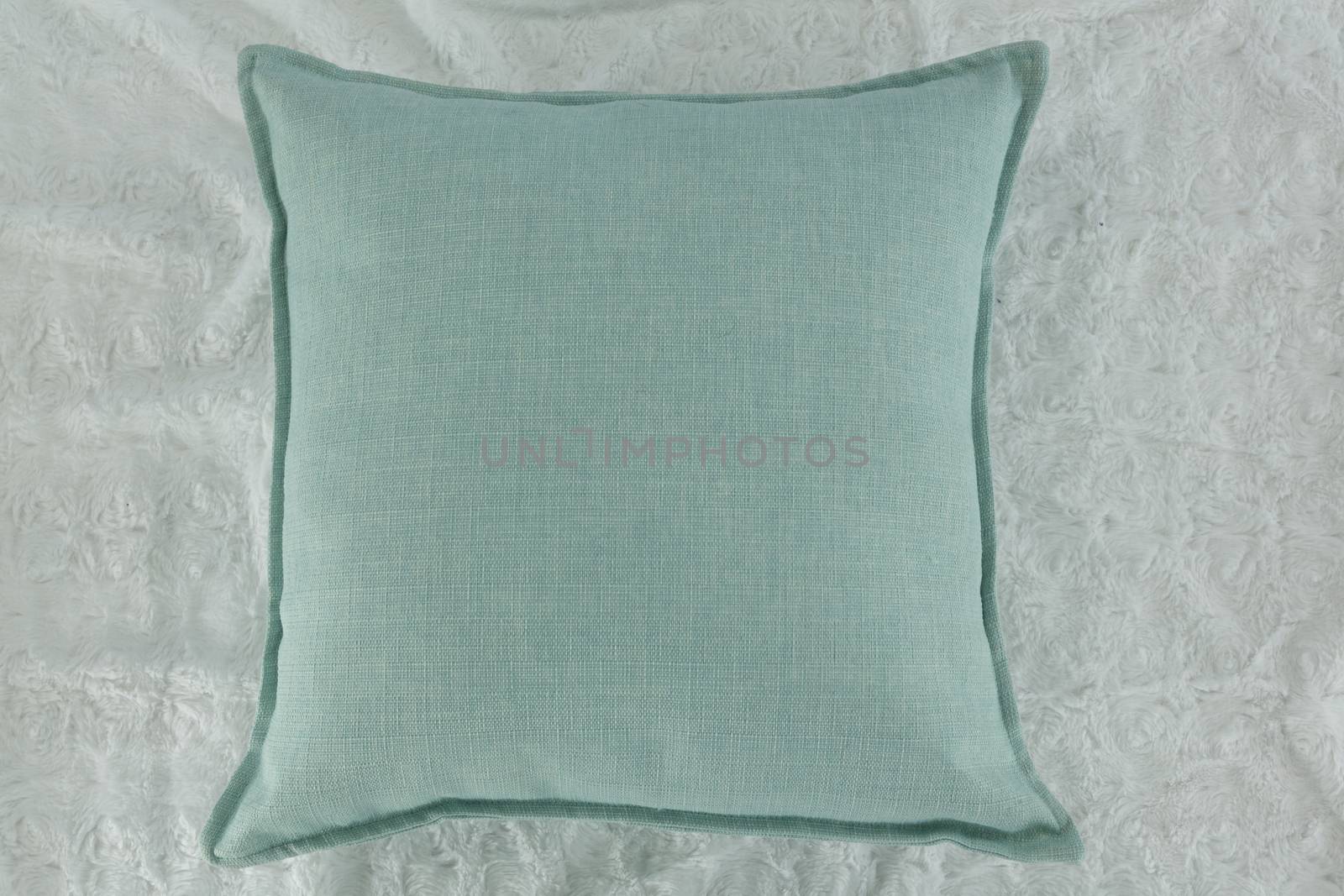 Close-up of cushion on textile