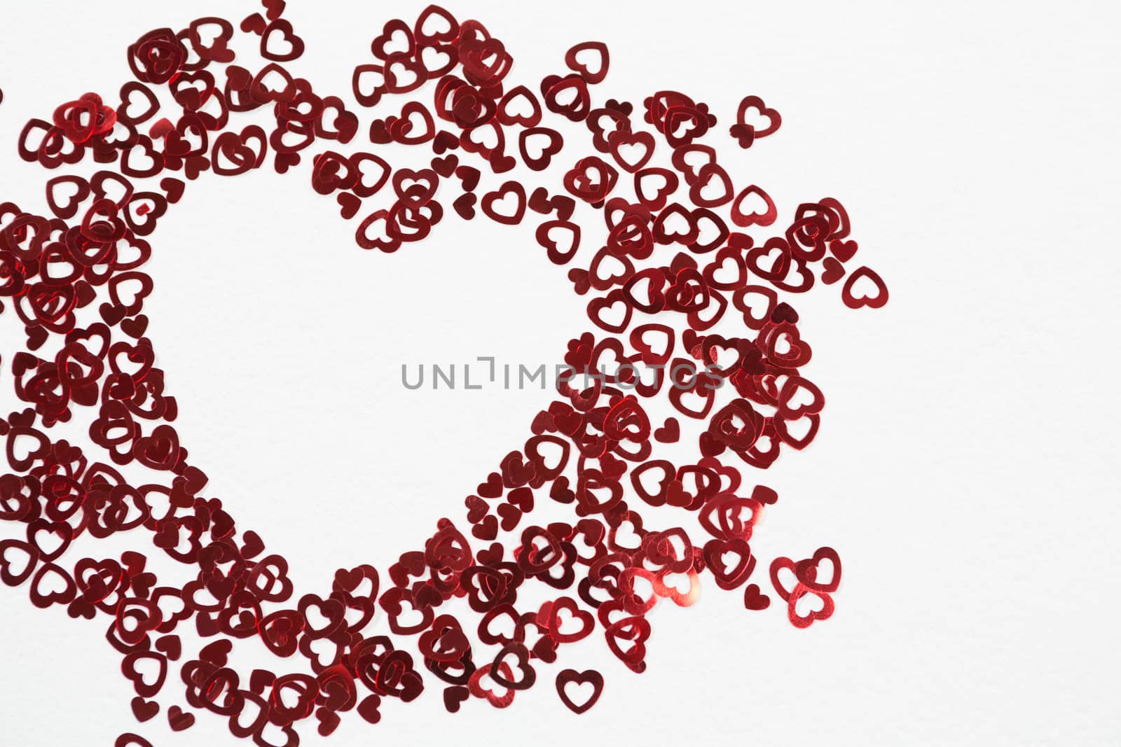Close-up of heart shape decorations arranged on white background