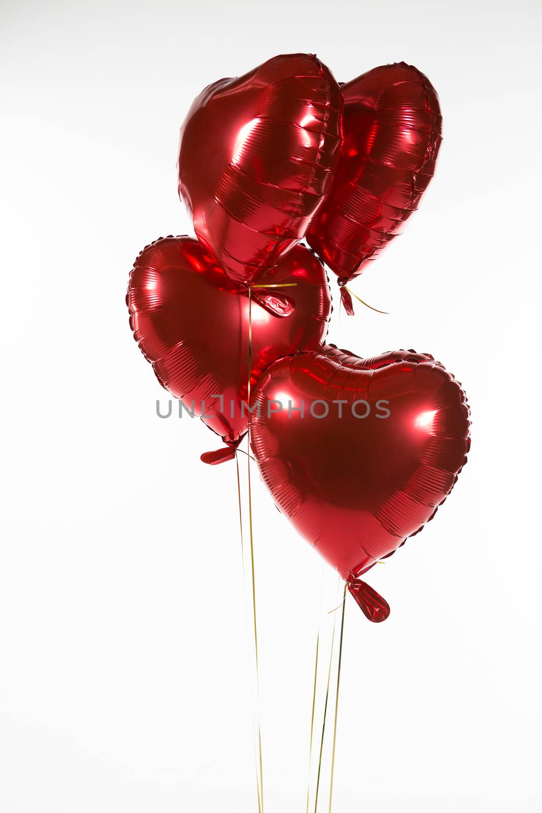Close-up of Valentine balloons against white background