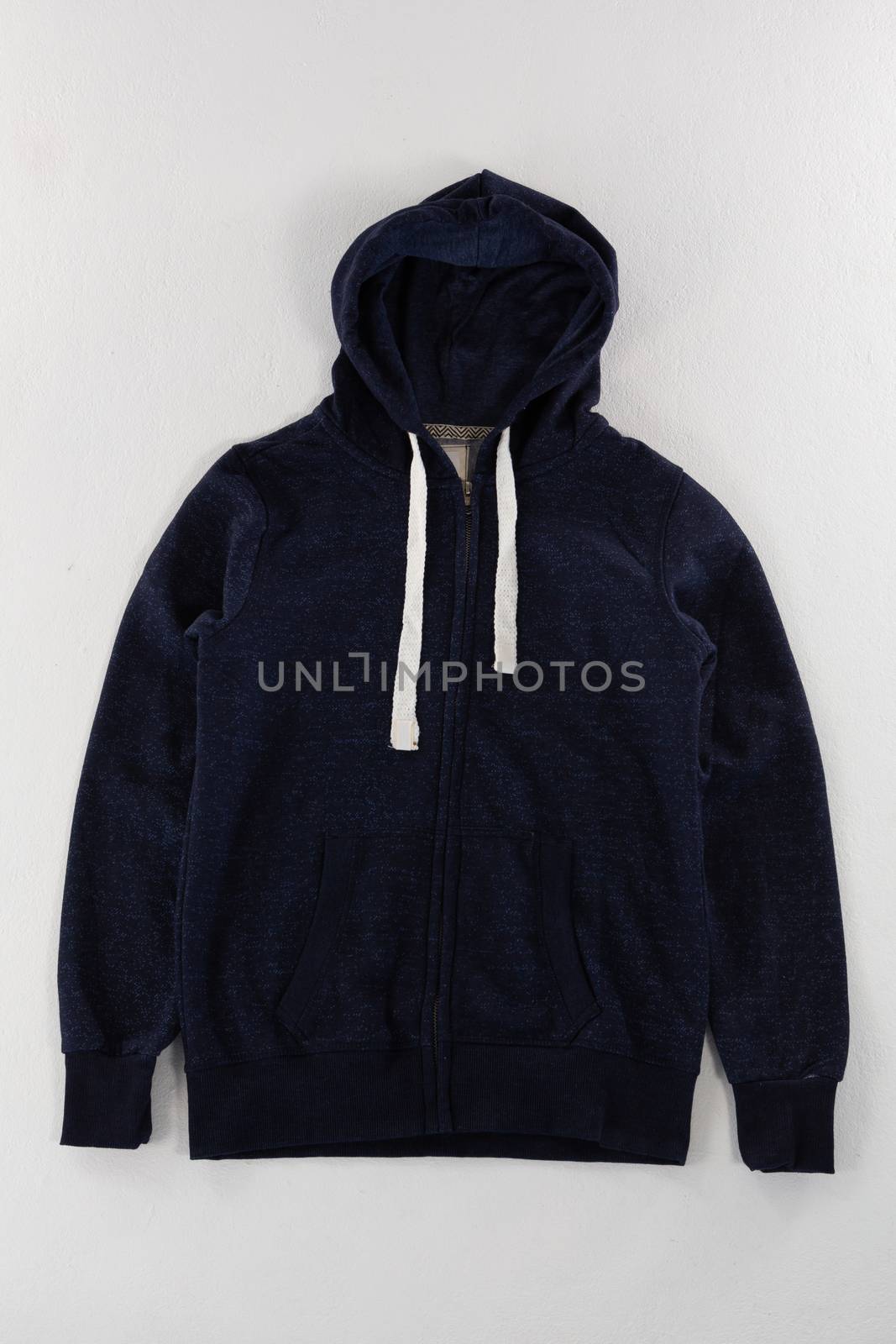 Close-up of hoodie jacket on white background