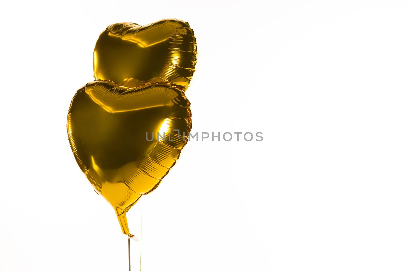 Close-up of Valentine balloons against white background