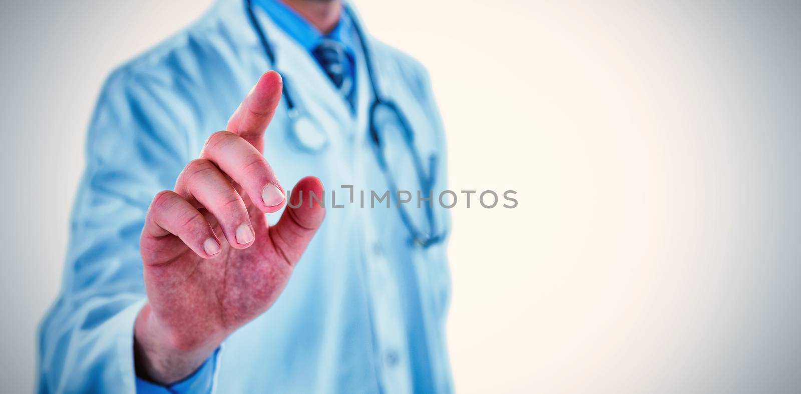 Midsection of doctor touching digital screen against white background