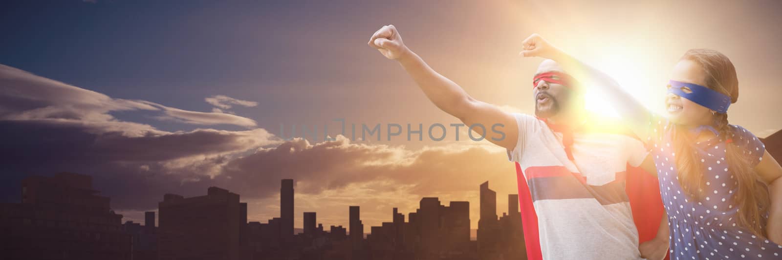 Composite image of father and daughter pretending to be superhero by Wavebreakmedia