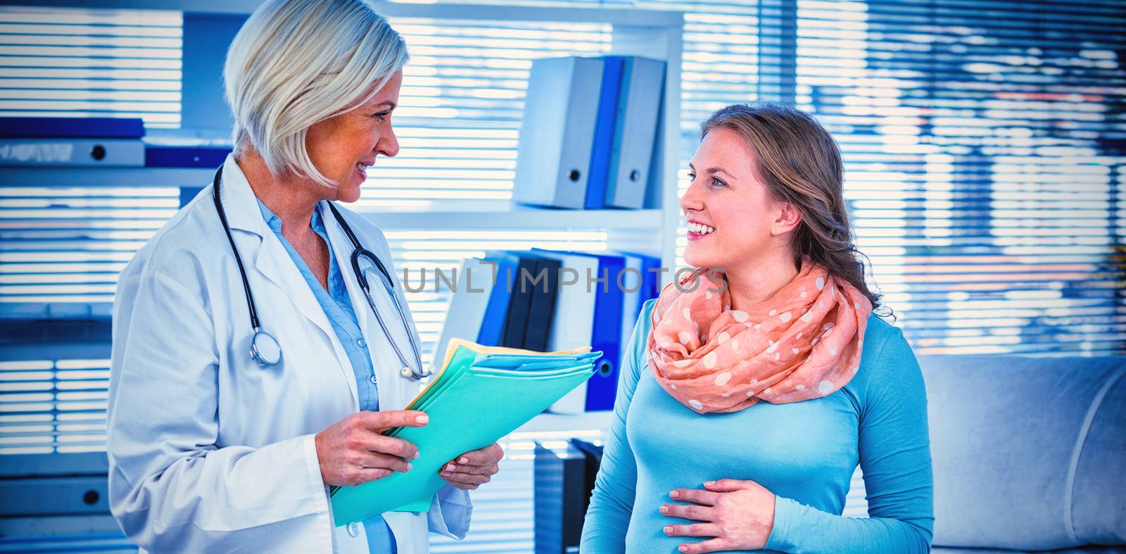 Pregnant patient consulting a doctor in hospital