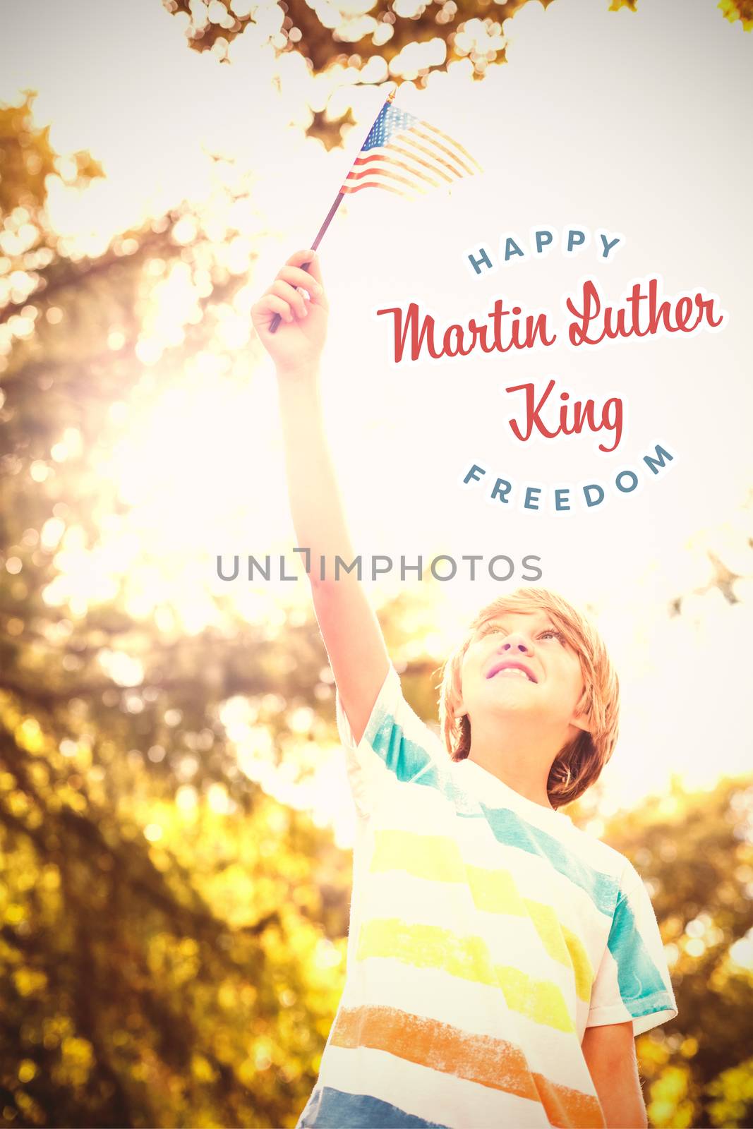 Boy looking at American flag against happy martin luther king freedom