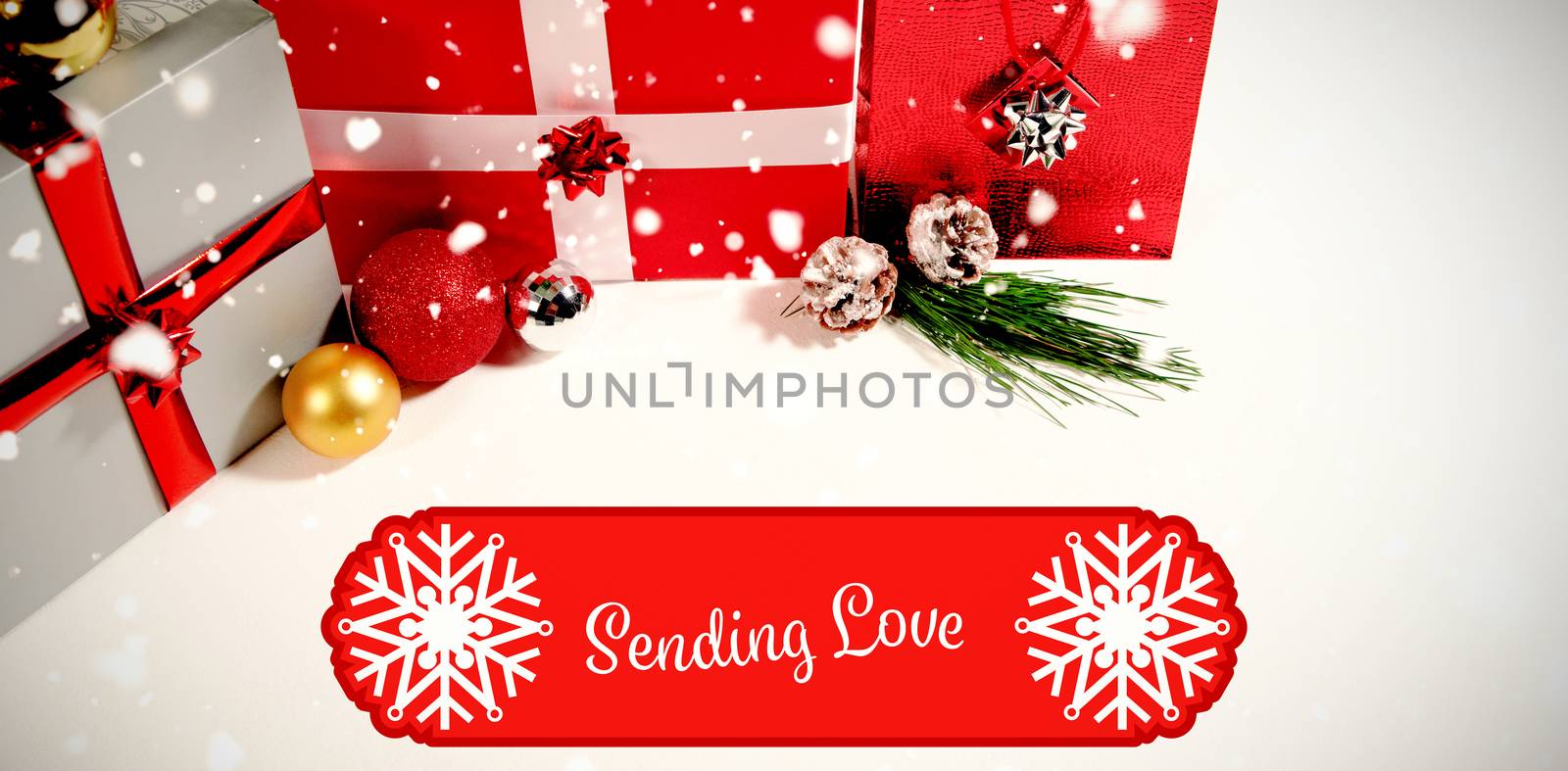 Banner sending love against christmas gifts against white background