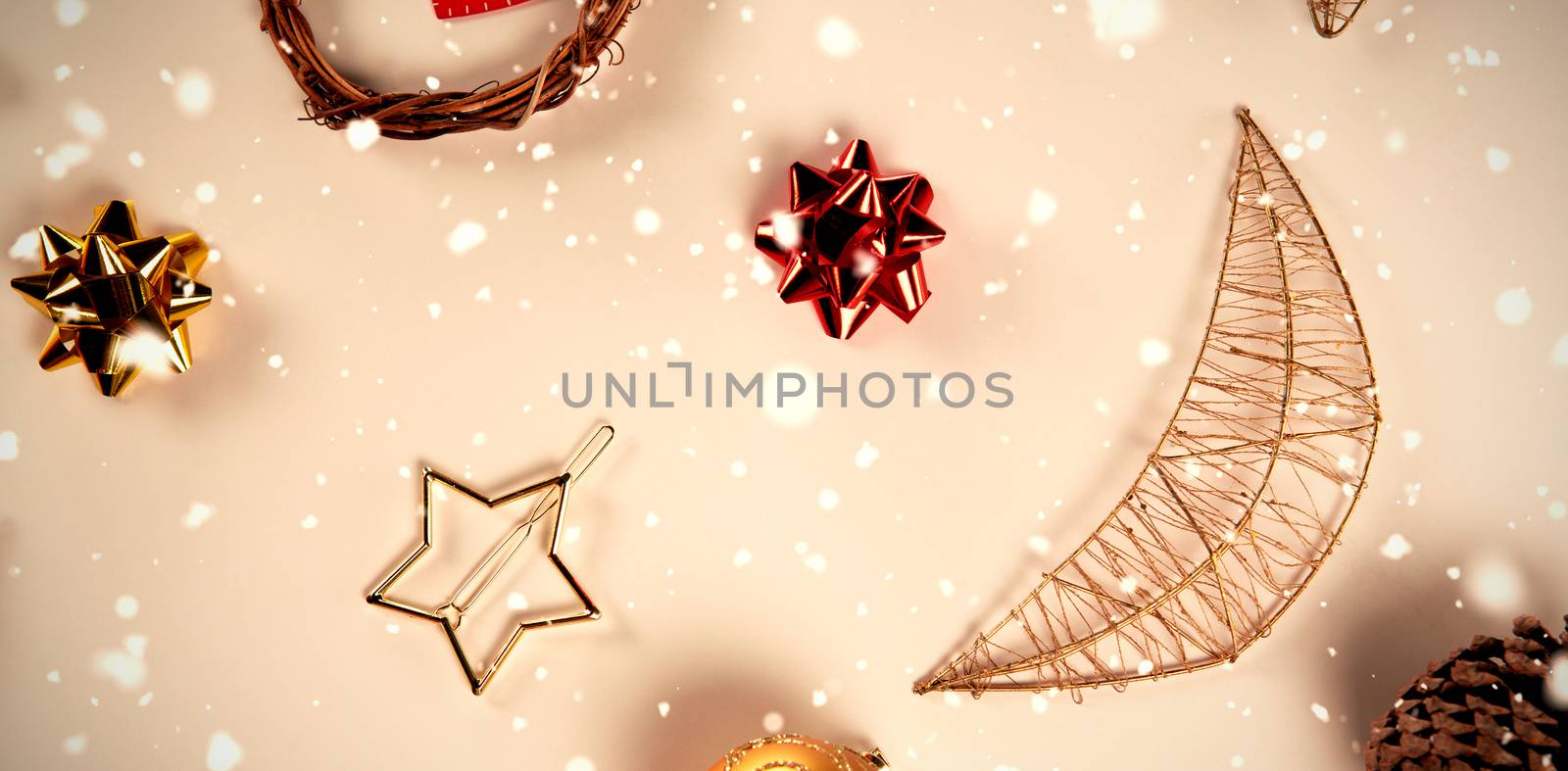 Snow falling against close up on christmas ornaments