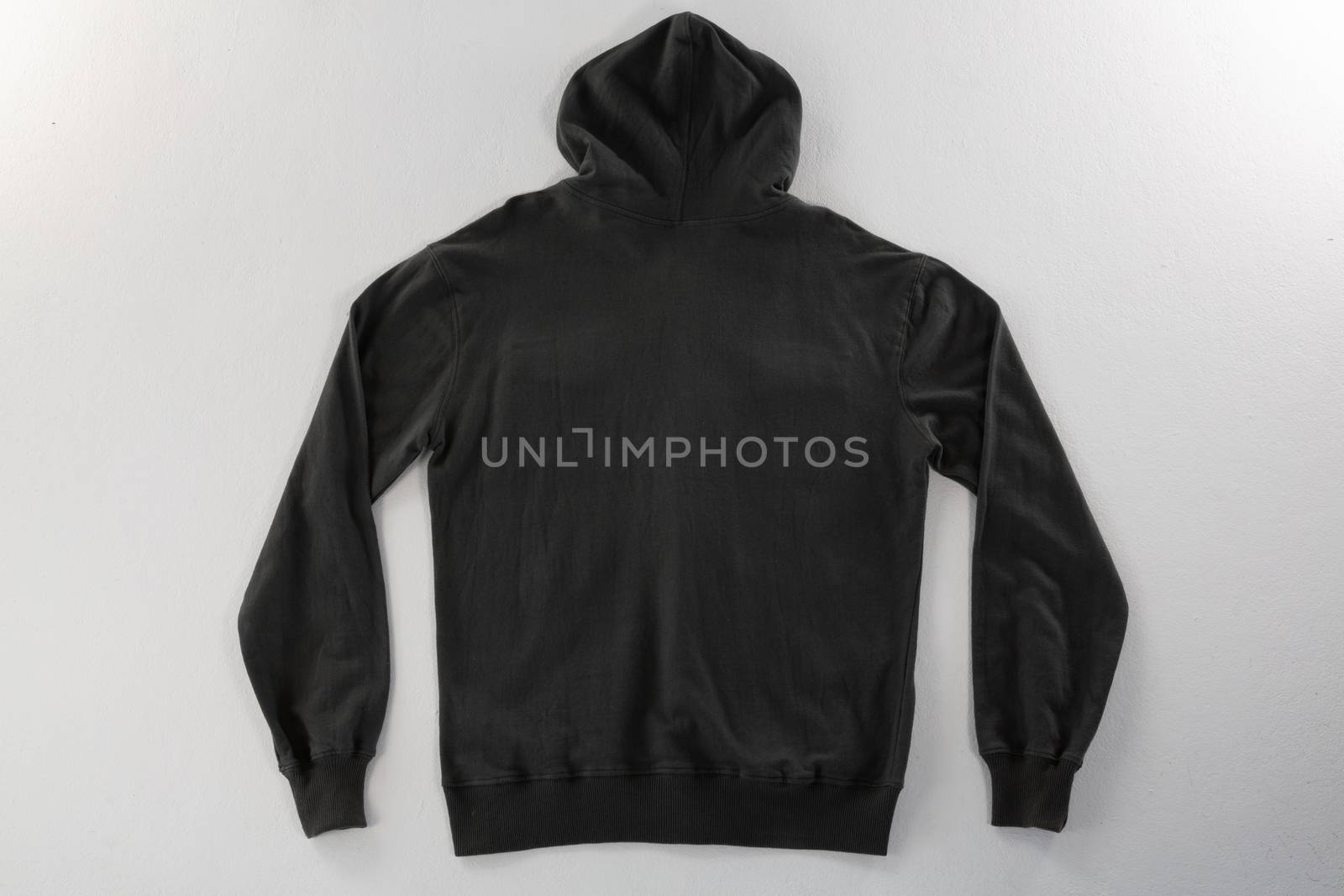 Close-up of hoodie jacket on white background