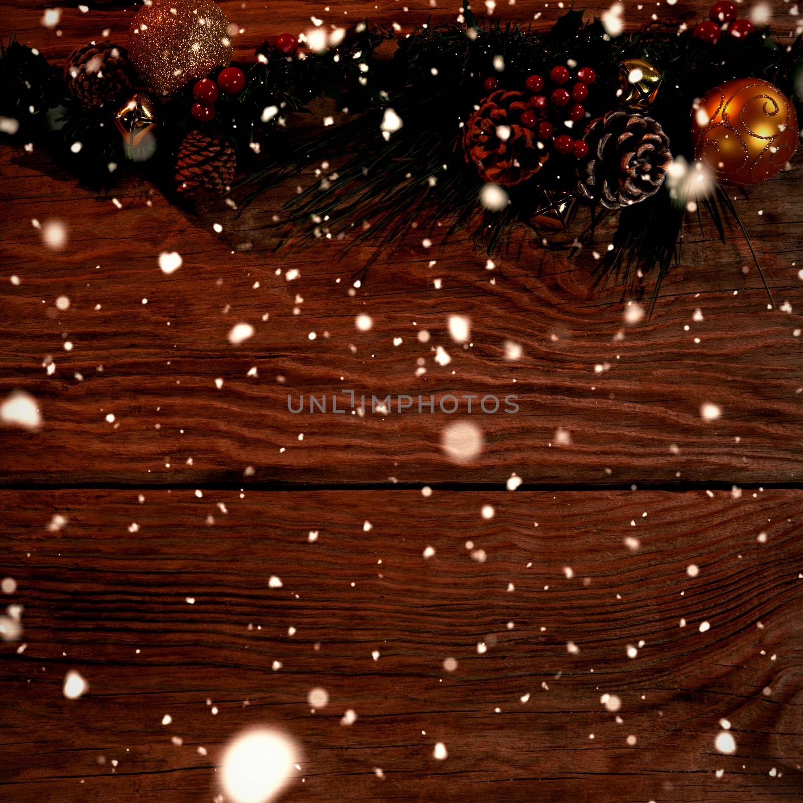 Snow falling against copy space with rustic christmas decorations