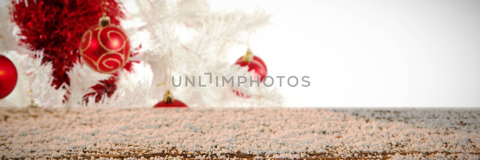 Composite image of wooden table covered with snow by Wavebreakmedia