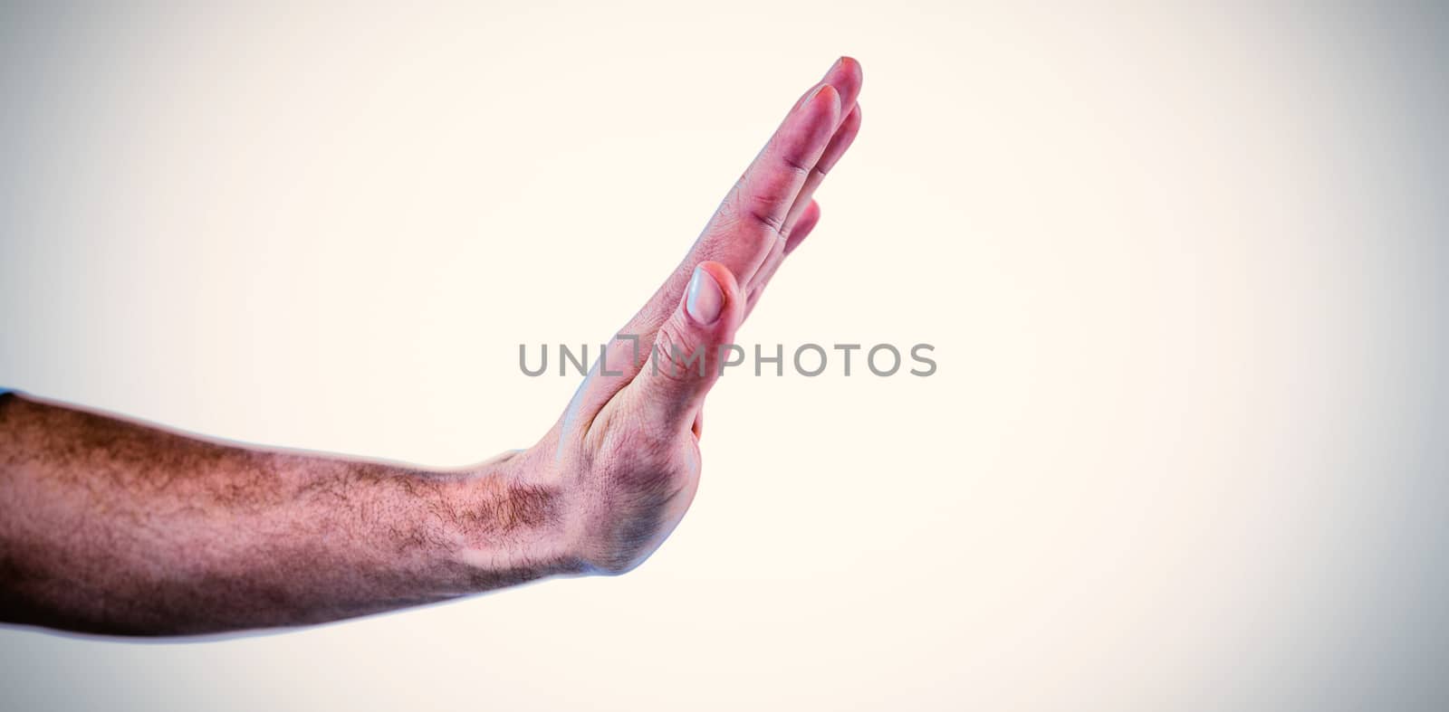 Cropped hand of man pretending to touch invisible screen against white background