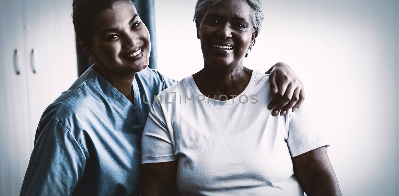 Portrait of young nurse with patient in nursing home by Wavebreakmedia