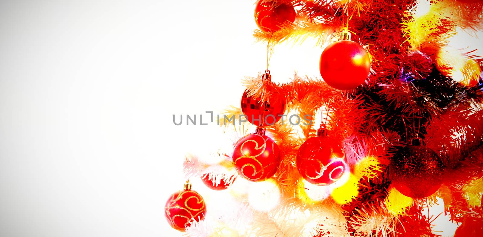 Composite image of table against close-up of christmas tree with decoration