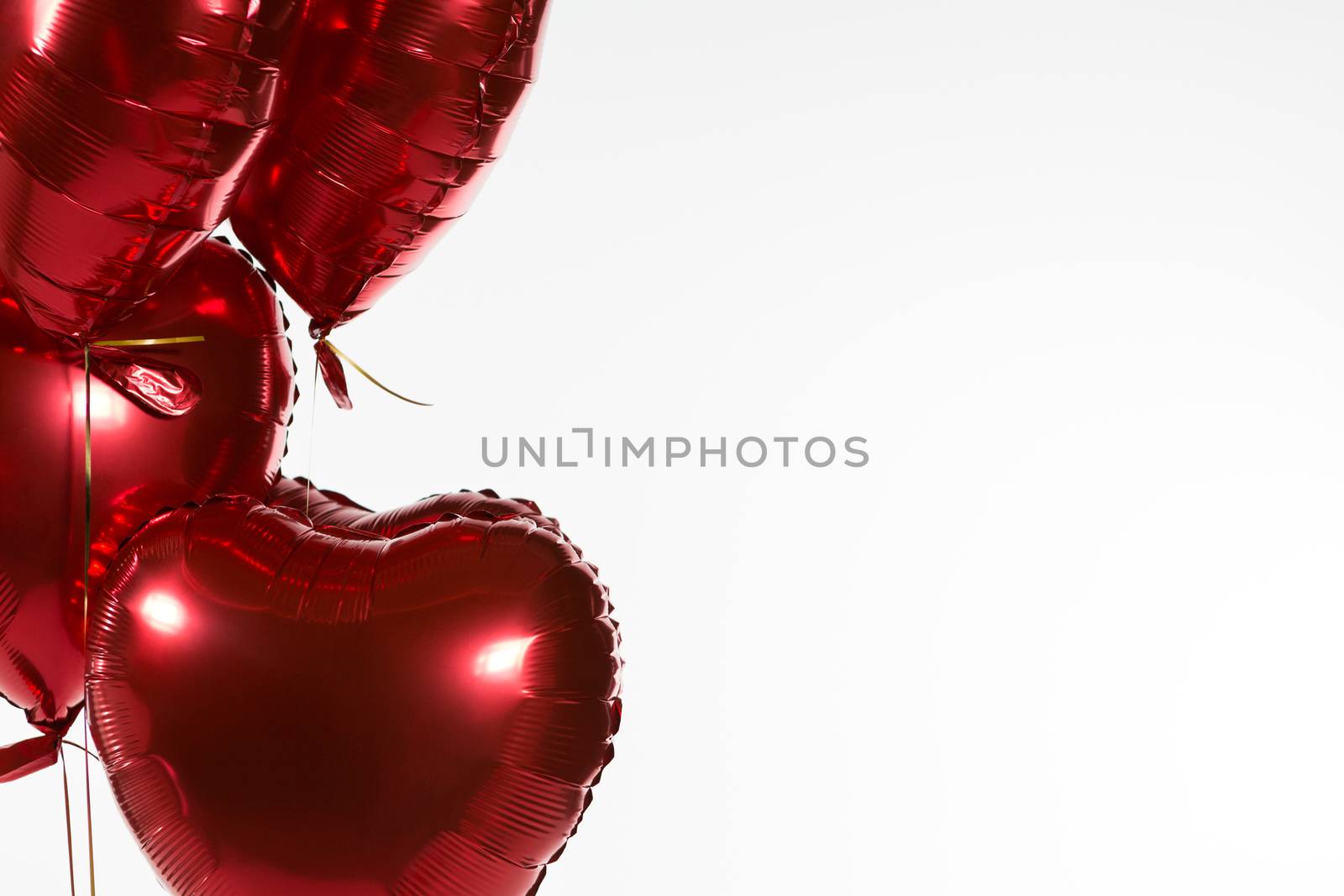 Close-up of Valentine balloons against white background