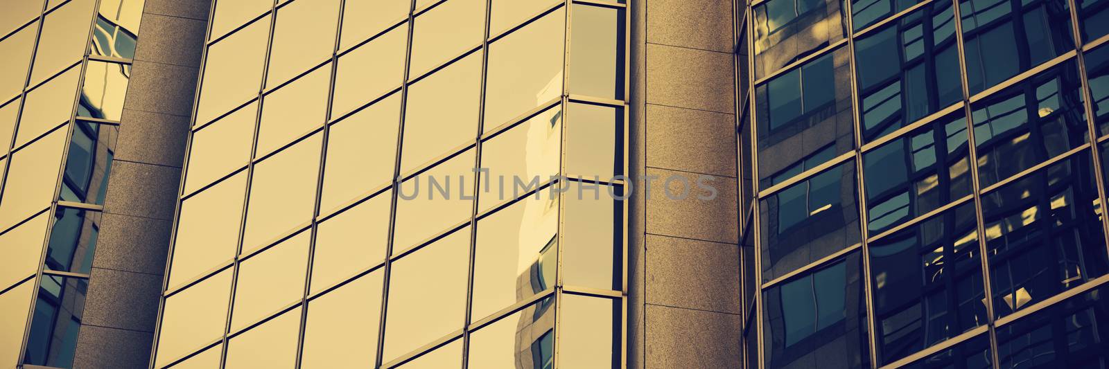close-up of glass office building  by Wavebreakmedia