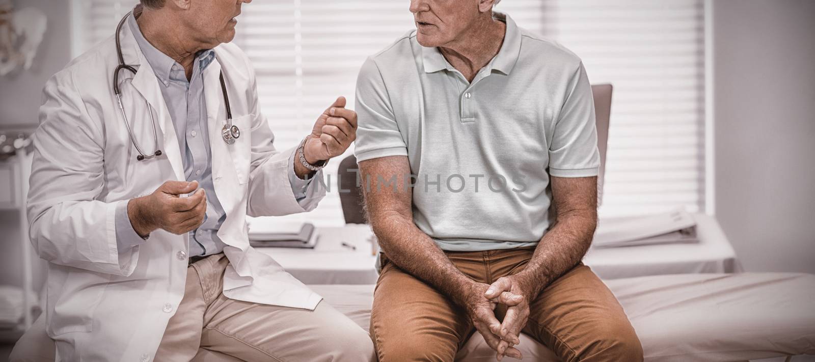 Doctor interacting with senior patient by Wavebreakmedia