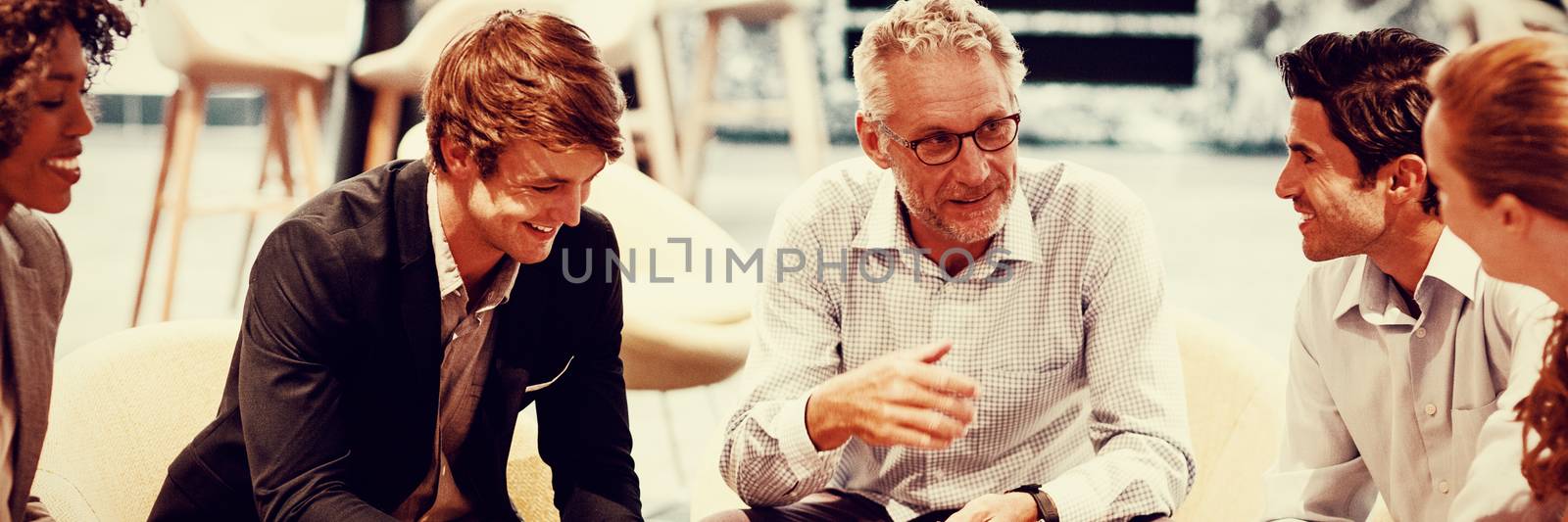 Business people having a discussion in cafeteria by Wavebreakmedia