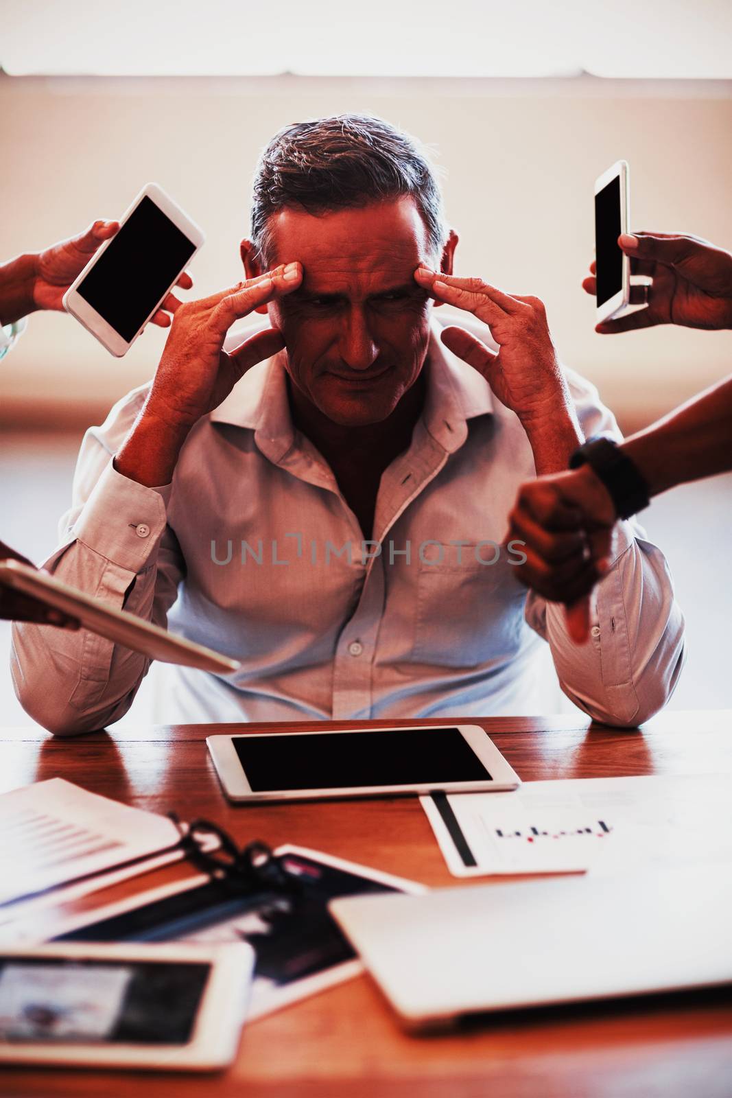 Businessman frustrated at his desk by Wavebreakmedia