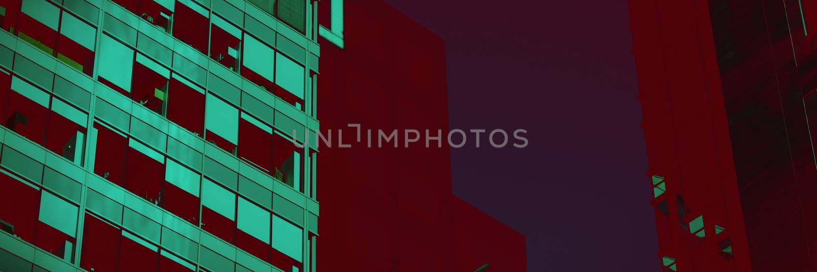ow angle view of modern glass buildings against sky by Wavebreakmedia
