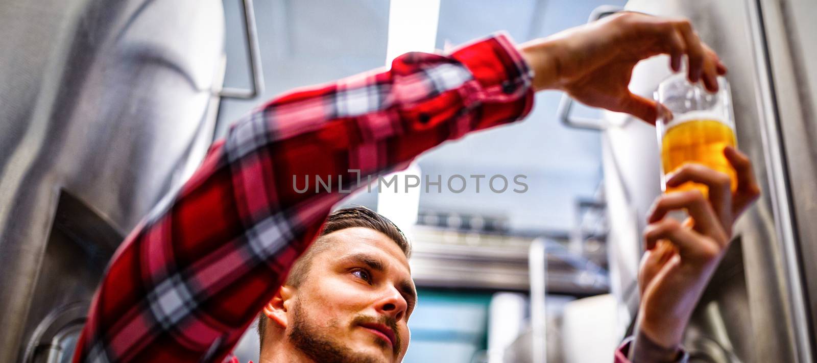 Brewers testing beer by Wavebreakmedia