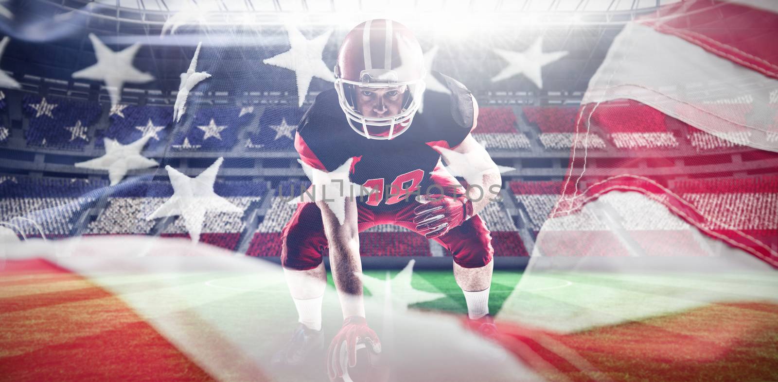 American football player in helmet taking position against full frame of american flag