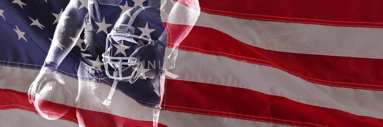 Close-up of an flag against american football player standing with helmet and rugby ball