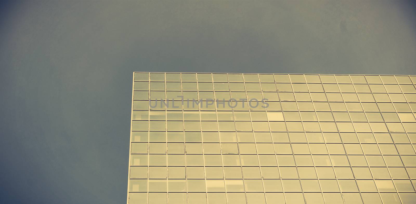 Office buildings against blue sky by Wavebreakmedia