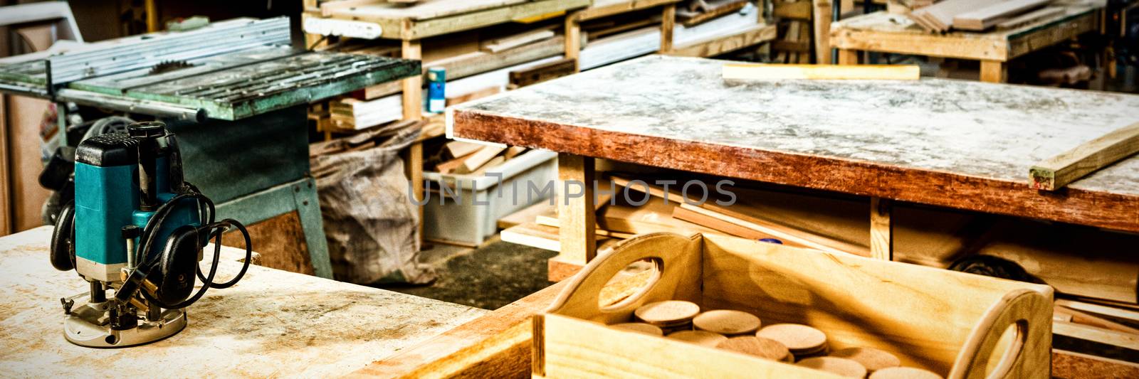 Carpentry workshop with wood plank and machinery