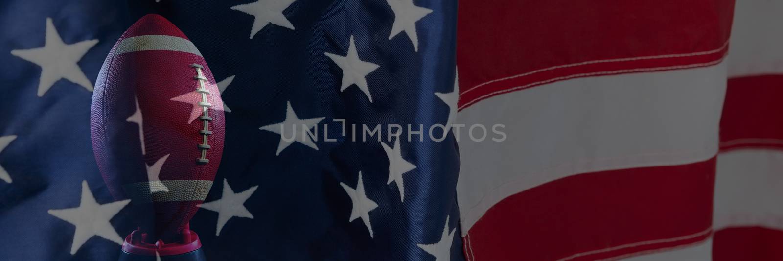 Close-up of an American flag against rugby ball
