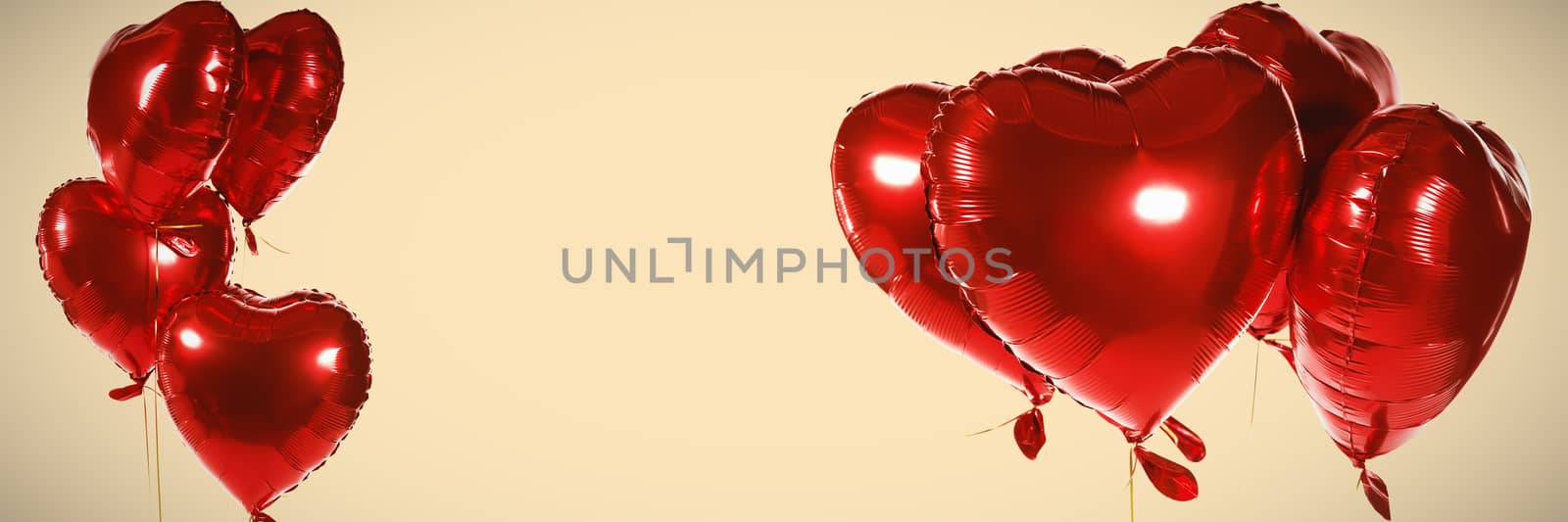 Red heart shape balloons against orange background