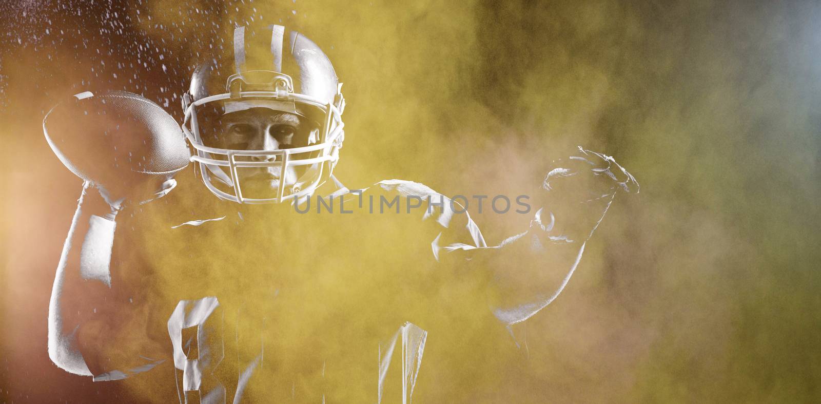 Splashing of dust powder against american football player throwing rugby ball