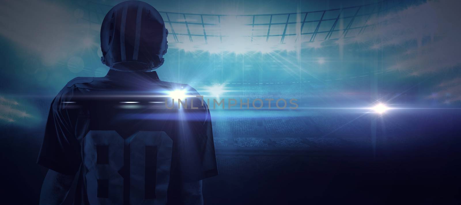 American football player standing in helmet against american football arena