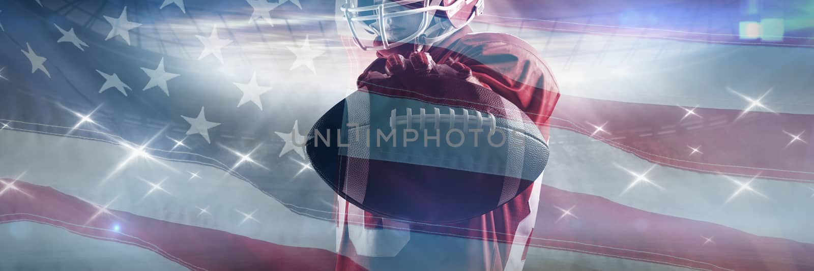 American football player standing in rugby helmet and holding rugby ball against close-up of an american flag