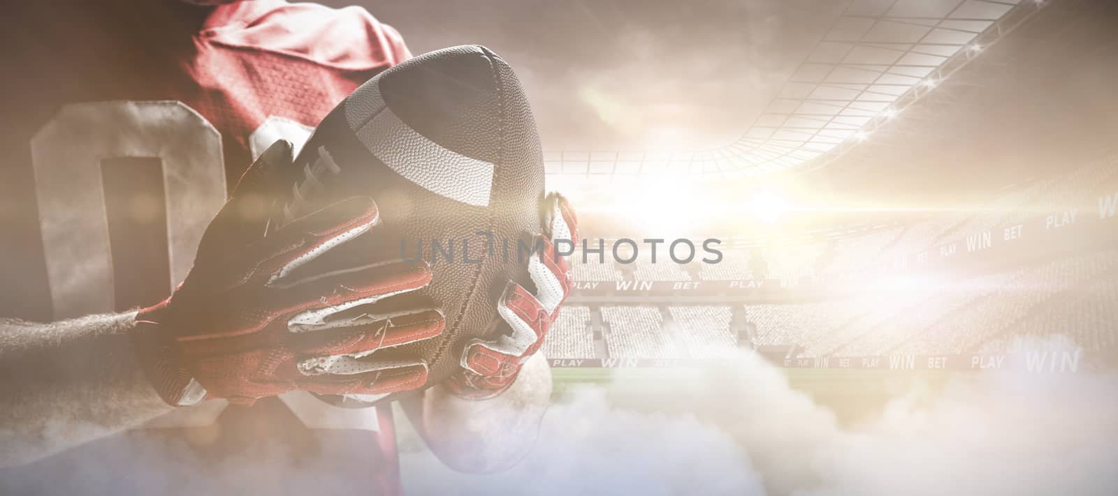 American football player holding rugby ball, Close-up