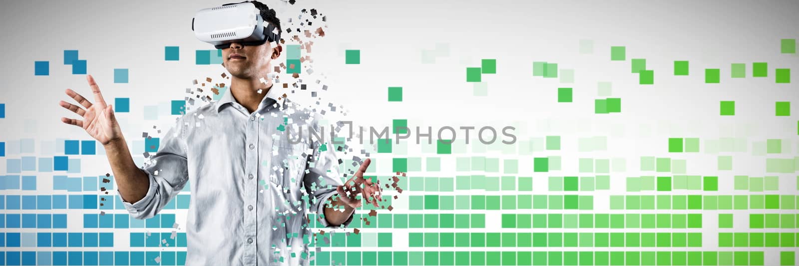 Man using virtual reality headset against blue and green squares