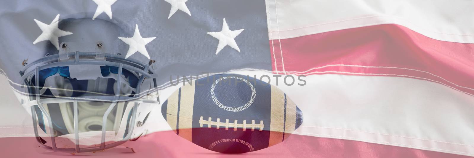 Sports helmet and American football against full frame of american flag