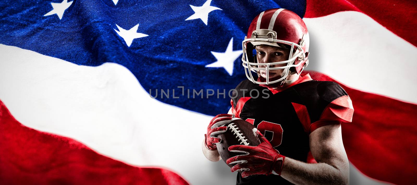 Composite image of american football player in helmet holding rugby ball by Wavebreakmedia