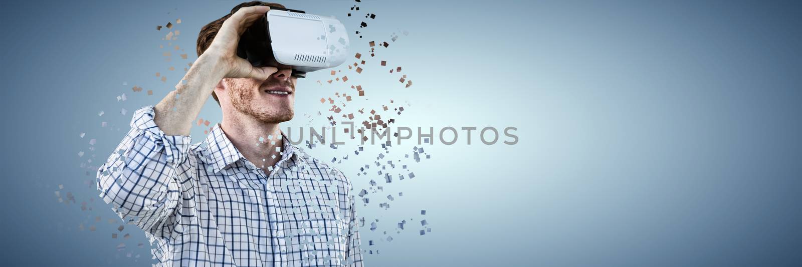 Smiling businessman working with VR against abstract blue background