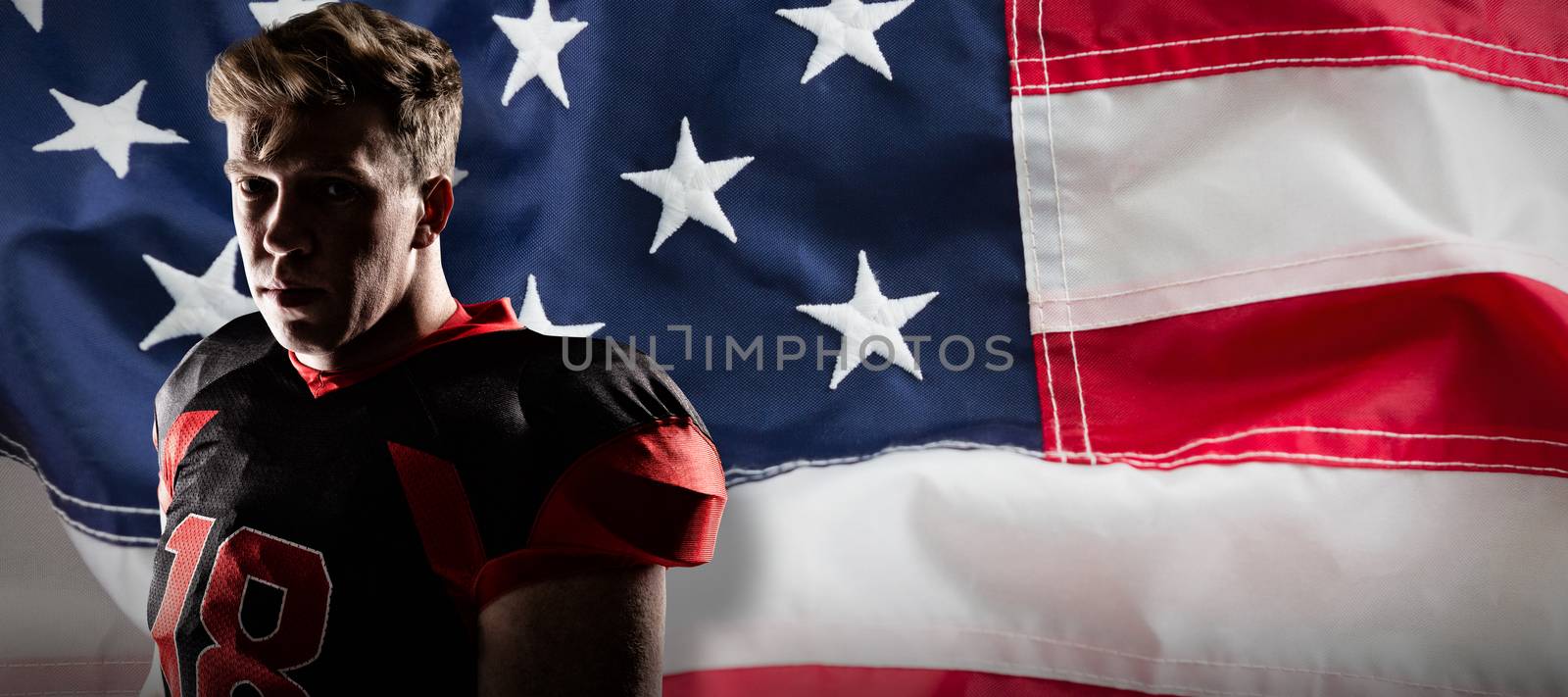 Volleyball player standing against full frame of american flag