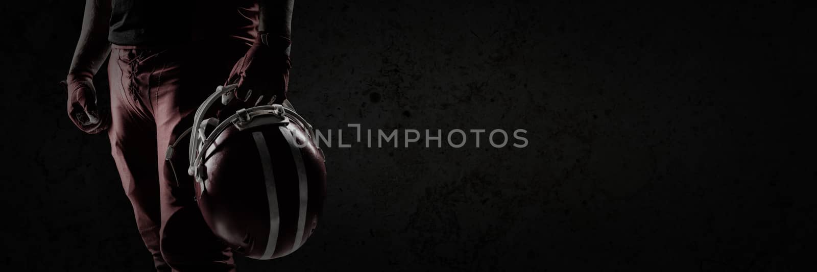 Composite image of volleyball player holding rugby helmet by Wavebreakmedia