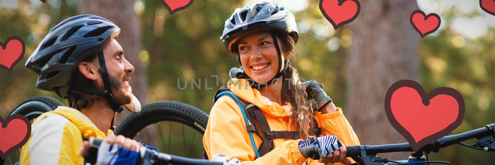Red Hearts against biker couple carrying mountain bike