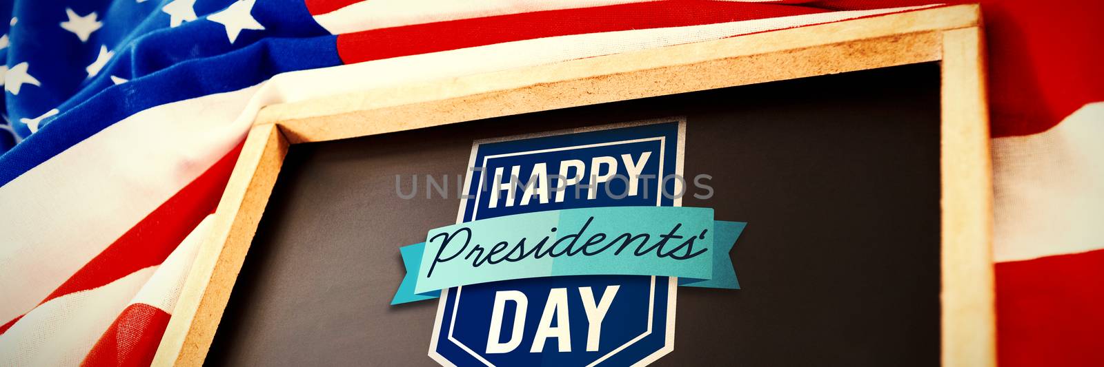 Happy presidents day against empty slate over american flag  on table