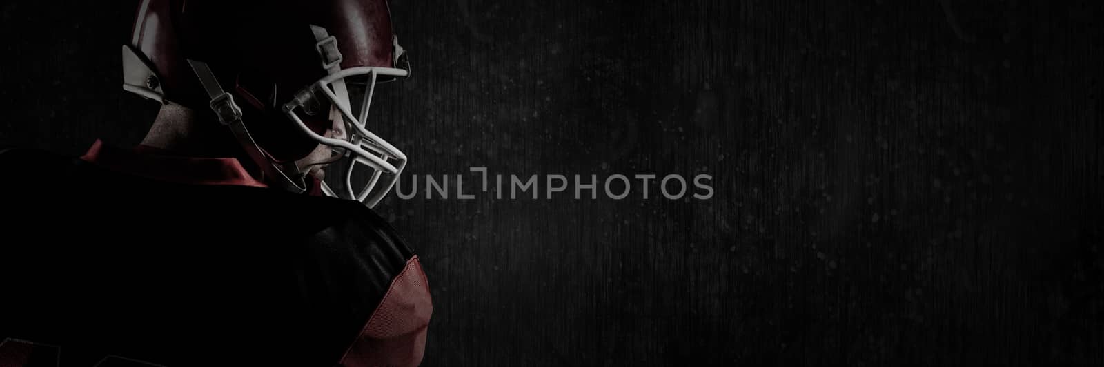 Composite image of american football player in helmet looking off to the side by Wavebreakmedia