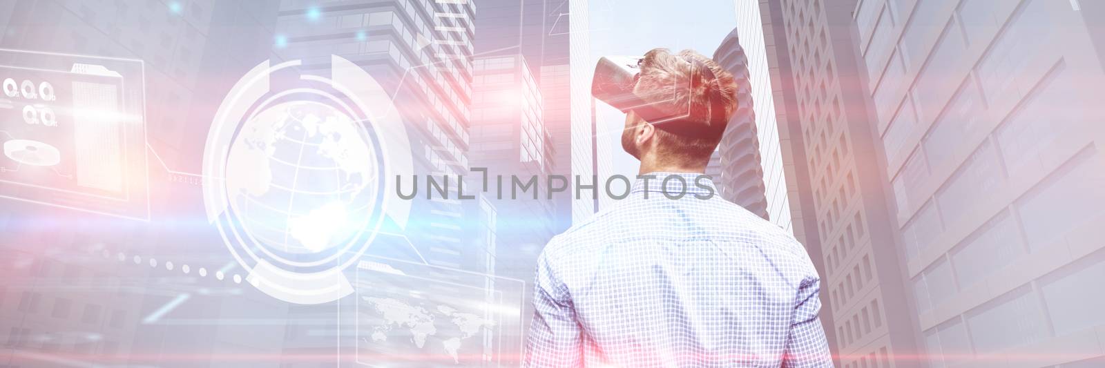 Man holding virtual reality glasses against composite image of technology interface 