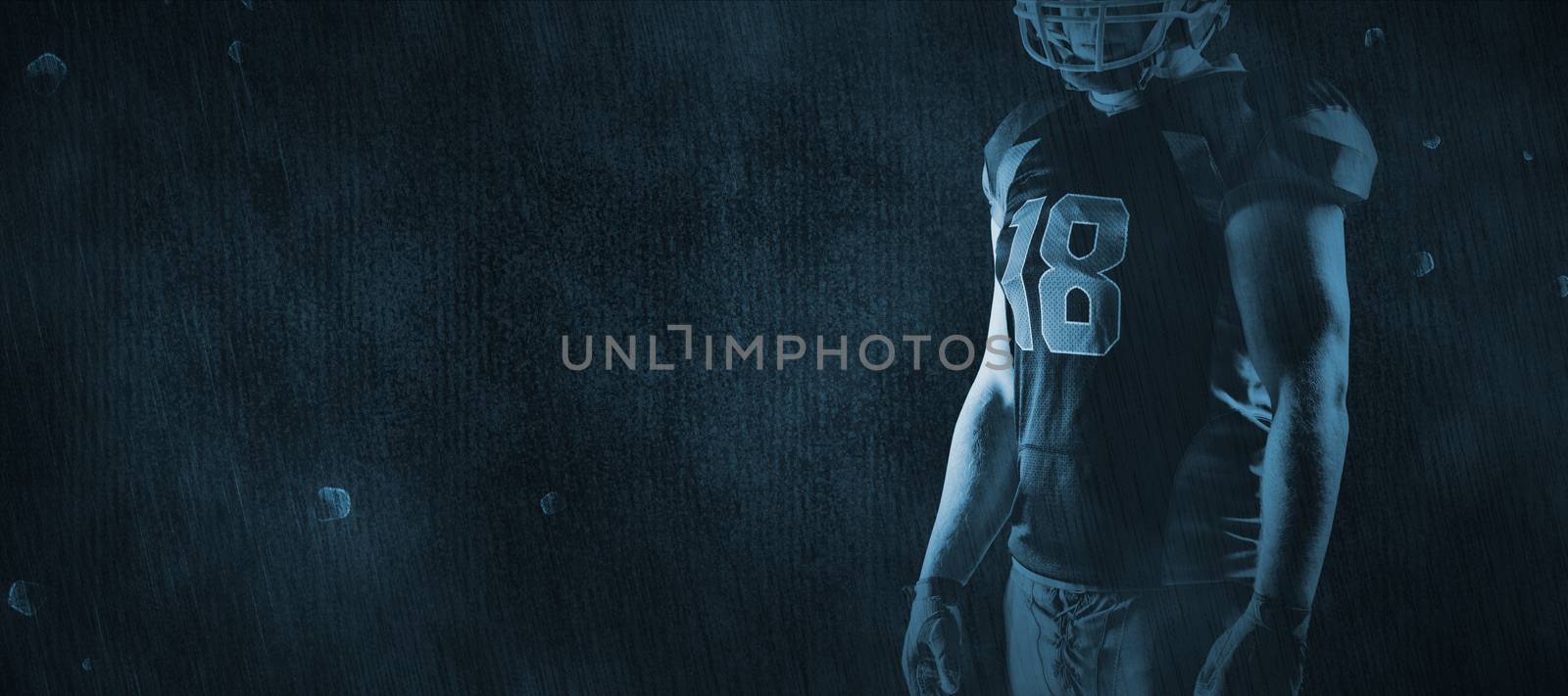 American football player standing with rugby helmet against brown textured background